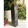 African Bloodstone Chunky Tower: A polished crystal tower known for its deep green and red hues, perfect for healing.