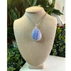 Blue Lace Agate crystal pendant necklace, featuring a delicate blue stone known for its calming and soothing properties.