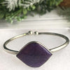 Charoite necklace and bangle bracelet set, showcasing vibrant purple stones, perfect for style and spiritual energy.