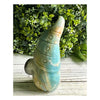 Ocean Blue Caribbean Calcite Gnome: Adorable figurine crafted from rare calcite, showcasing soothing ocean hues.