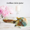 Caribbean Calcite guitar carving for music lovers with soothing blue and orange hues. Perfect for adding a touch of serenity to your space.