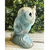 Caribbean Calcite crystal owl carving, showcasing vibrant blue and white hues, symbolizing wisdom and tranquility.