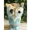 Caribbean Calcite crystal owl carving, showcasing vibrant blue and white hues, symbolizing wisdom and tranquility.