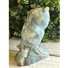 Caribbean Calcite crystal owl carving, showcasing vibrant blue and white hues, symbolizing wisdom and tranquility.