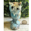 Caribbean Calcite crystal owl carving, showcasing vibrant blue and white hues, symbolizing wisdom and tranquility.