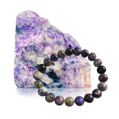 Elegant Genuine Charoite Stone Bead Bracelet for spiritual balance and personal transformation. Unique and vibrant purple crystals.