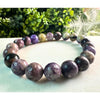 Elegant Genuine Charoite Stone Bead Bracelet for spiritual balance and personal transformation. Unique and vibrant purple crystals.