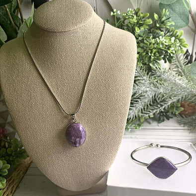 Charoite necklace and bangle bracelet set, showcasing vibrant purple stones, perfect for style and spiritual energy.