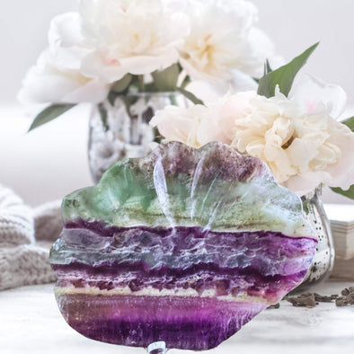 Rainbow Fluorite Crystal Shell Bowl with vibrant swirls of purple, green, and blue, perfect for decor or crystal use