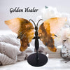 Natural Golden Healer crystal butterfly with quartz crystals, showcasing intricate golden and clear patterns for healing and transformation.