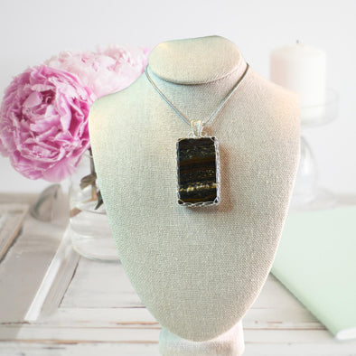 Iron Tiger's Eye crystal pendant necklace, featuring a stunning gemstone with rich golden and brown hues.