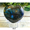 Blue Labradorite heart-shaped crystal showcasing shimmering flashes of blue and green for a stunning decorative piece.