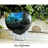 Blue Labradorite heart-shaped crystal showcasing shimmering flashes of blue and green for a stunning decorative piece.