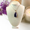 Uruguay Amethyst pendant necklace showcasing a stunning purple gemstone set in a delicate silver design.