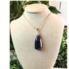 Uruguay Amethyst pendant necklace showcasing a stunning purple gemstone set in a delicate silver design.