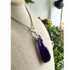 Uruguay Amethyst pendant necklace showcasing a stunning purple gemstone set in a delicate silver design.