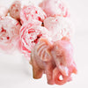 Natural pink opal crystal elephant carving with delicate pink hues and intricate details, symbolizing strength, wisdom, and tranquility.