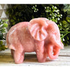 Natural pink opal crystal elephant carving with delicate pink hues and intricate details, symbolizing strength, wisdom, and tranquility.