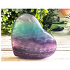 Rainbow Fluorite Crystal Heart – A vibrant healing stone for balance, clarity, and emotional well-being.