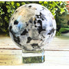 Rainbow Moonstone Crystal Sphere showcasing iridescent colors, ideal for meditation and enhancing intuition.