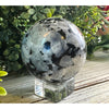 Rainbow Moonstone Crystal Sphere showcasing iridescent colors, ideal for meditation and enhancing intuition.