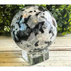 Rainbow Moonstone Crystal Sphere showcasing iridescent colors, ideal for meditation and enhancing intuition.