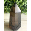 Smoky Quartz Crystal Tower: A polished gemstone tower showcasing the natural beauty of smoky quartz by Crystal Heart Journeys