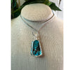 Genuine Turquoise Pendant Necklace showcasing vibrant blue hues and natural stone texture, perfect for any outfit.